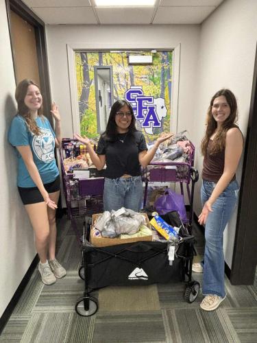  dietetics and nutritional sciences majors Violet Rozelle, SAND vice president and junior from Pearland; Brianna Tenorio, SAND treasurer and senior from Houston; and Sadie Scoggins, SAND president and senior from Hawkins