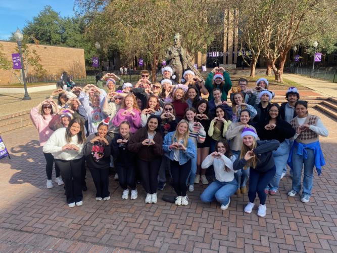 group photo of students who participated in SFA's Nelson Rusche College of Business Swift-Mas Showcase
