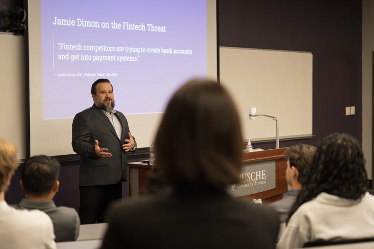 Rich Perez leads an in-clasroom session with bankers and SFA students