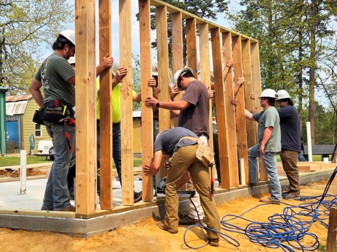 Stephen F. Austin State University’s construction management students working on their capstone project at The Village Nac.