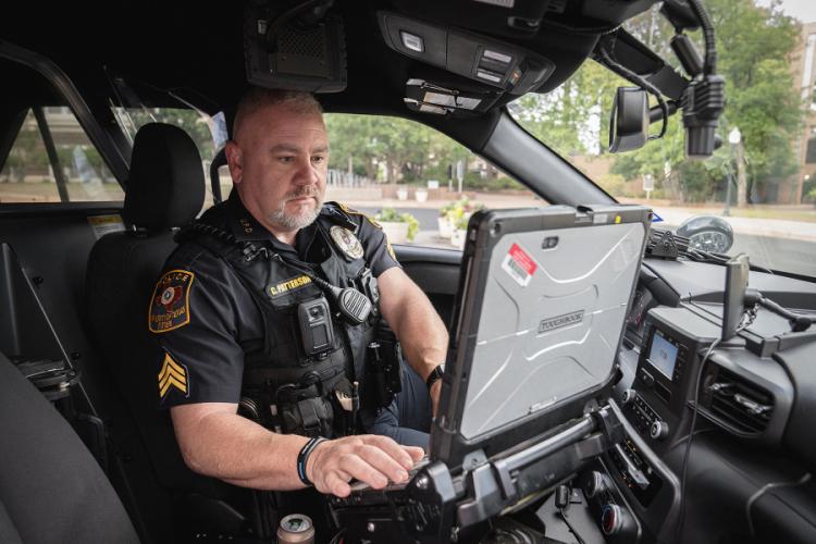 Sgt. Clint Patterson starting patrol with his laptop.