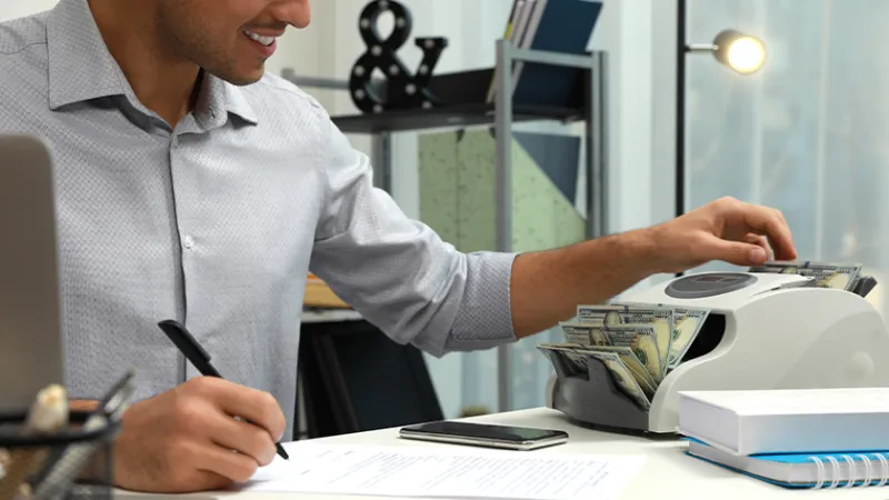 Banker counting money