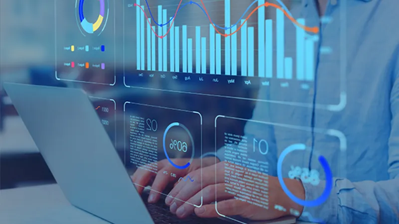 Stock image of a man analyzing data with graphic numbers overlayed