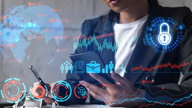 Stock image of a woman analyzing data with graphic numbers overlayed
