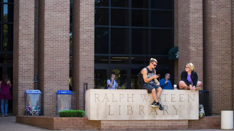 Students relaxing outside the library