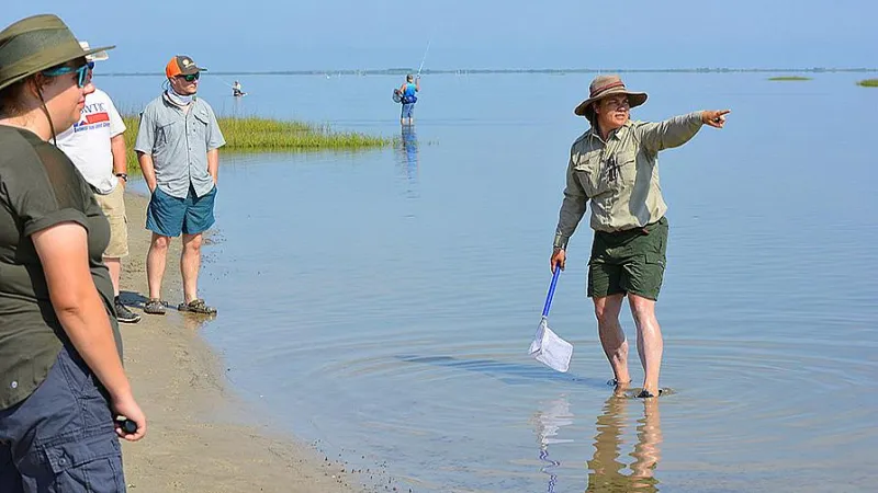 Students standing in shallow water
