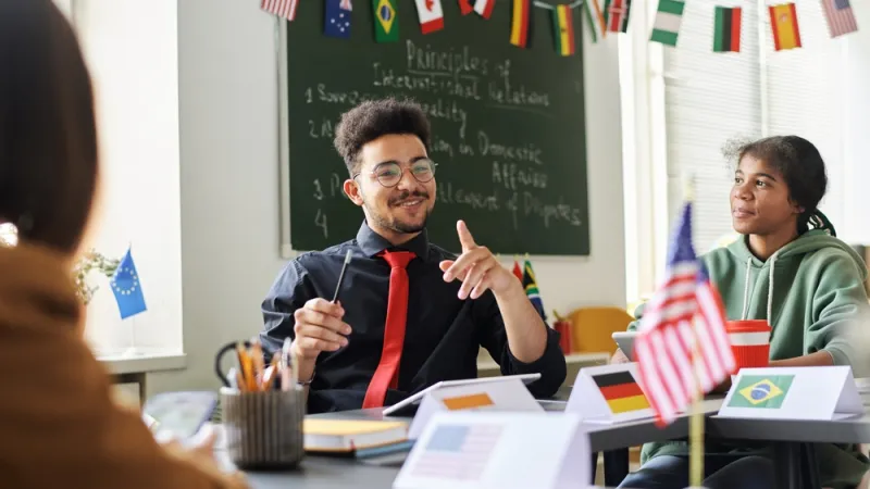 Teacher talking about holiday to students in class