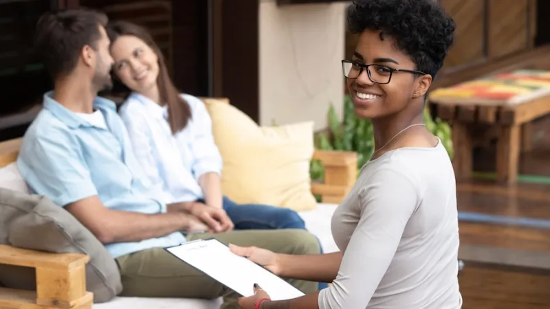 couple sitting on sofa visit medical professional therapists counselor