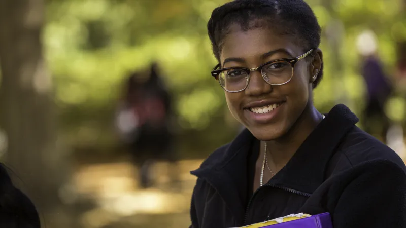 Student smiling at the camera 