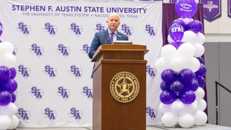 Athletic Director Michael McBroom at a press conference