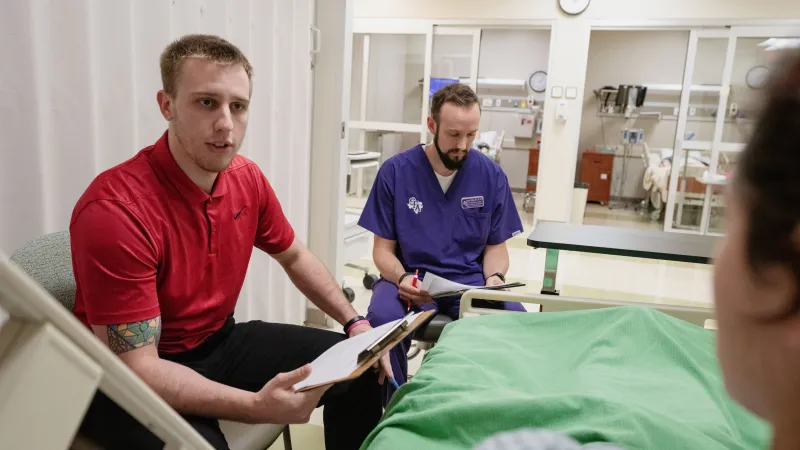 Student works through a nutrition simulation with faculty mentor