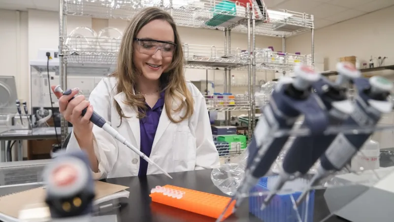 Hadley Watts taking samples
