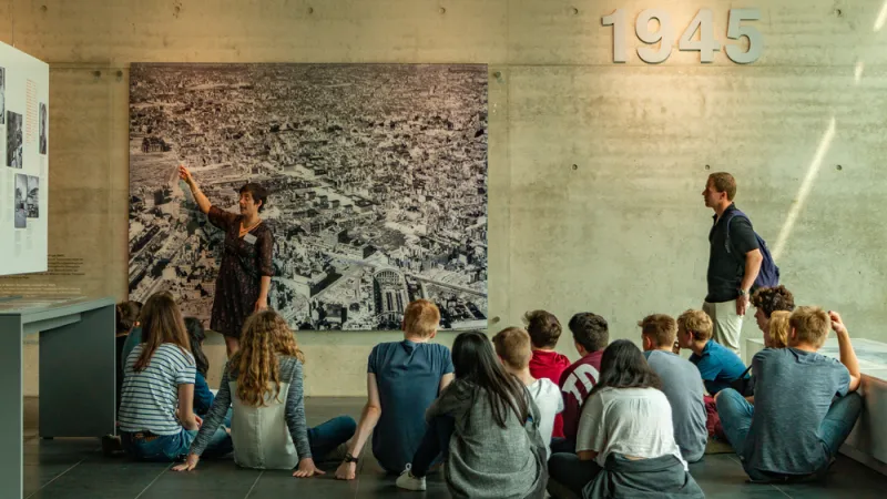 Teacher discussing history with class
