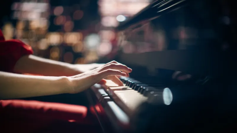 Closeup of hands playing piano