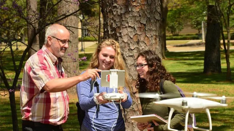 Students learning to fly a drone