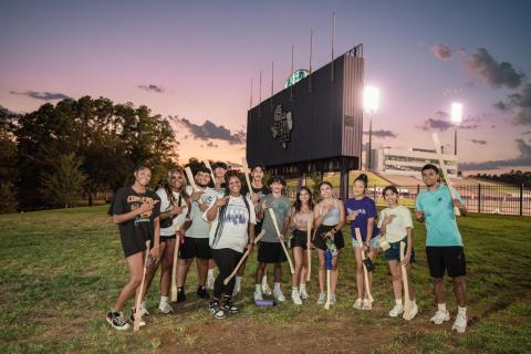 student group photo with axe handles
