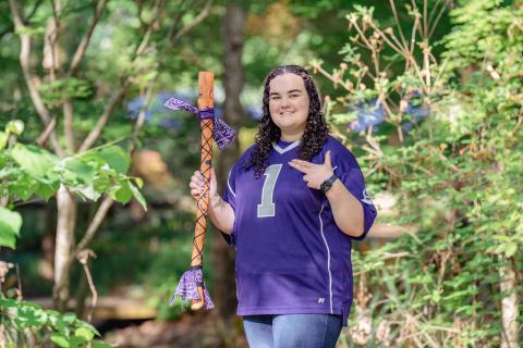 student holding axe handle
