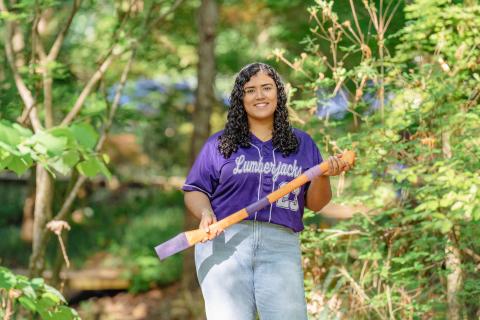 student holding axe handle