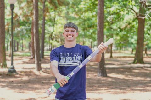 student holding axe handle