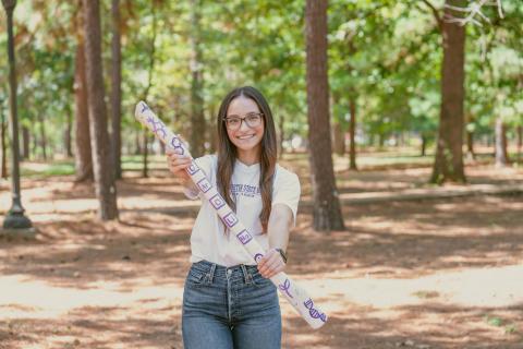 student holding axe handle