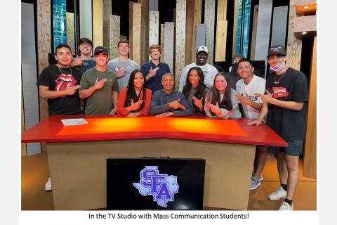 in the TV studio with Mass Communication students