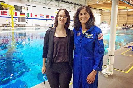 Astronaut Suni Williams poses with Volkman in NASA's Neutral Buoyancy Lab. Volkman was producing coverage of a visit to the lab by U.S. Vice President Mike Pence. Photo courtesy of Sarah Volkman
