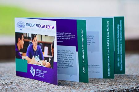 The Student Success Center brochure is handed out at Orientations and full of navigational information for students who may need academic, social or economic support. The piece is a saddle-stitched folded waterfall brochure.