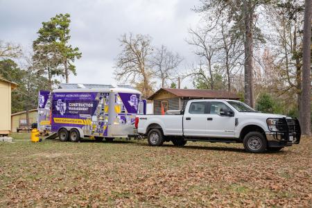 Construction Management program's truck and trailer at the event.