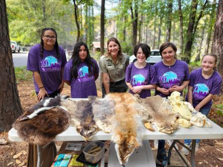 Hands on with animal pelts at Caddo Late State Park