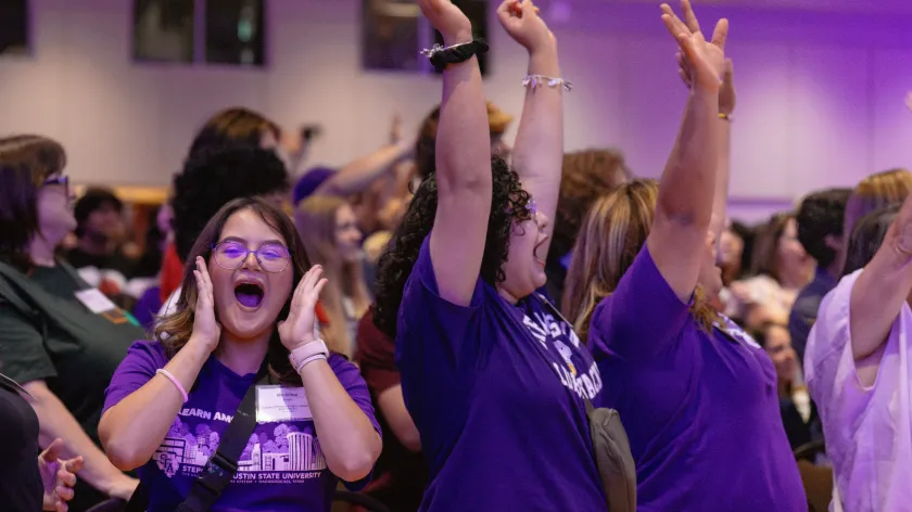 Students cheering at orientation