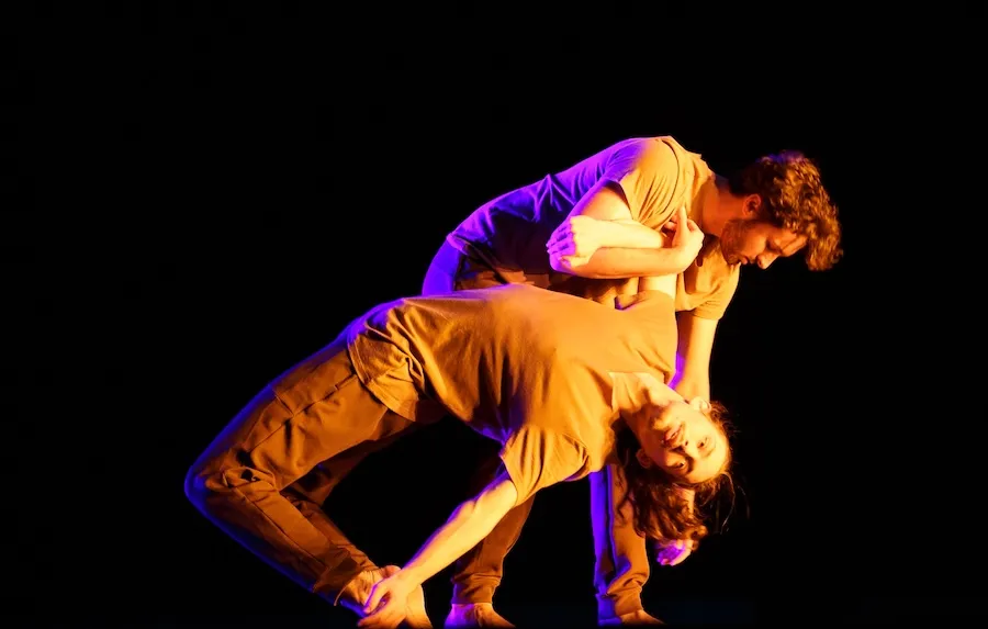 Students performing a dance on stage