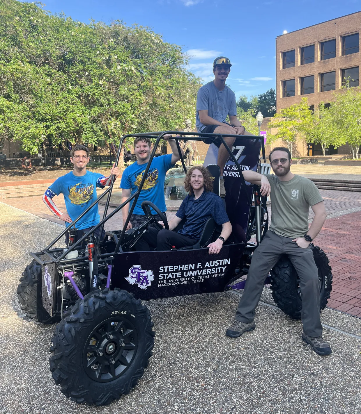 SFA Baja SAE team with their off-road Baja vehicle
