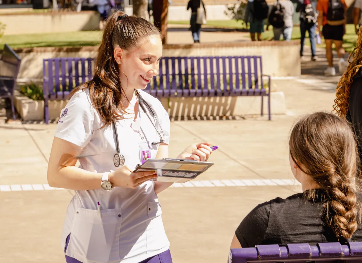 Nursing student taking vitals flipped image