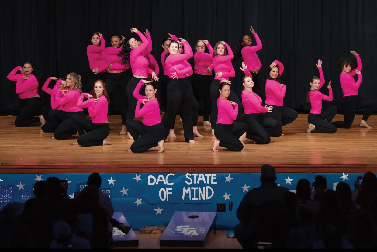 Students performing dance on stage