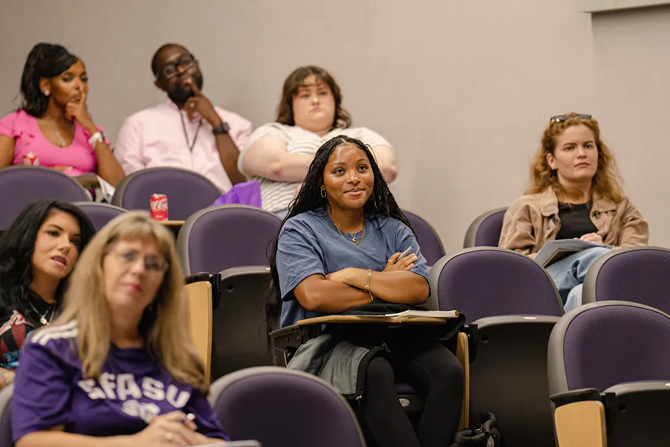 A student sits in a classroom A student sits in a classroom
