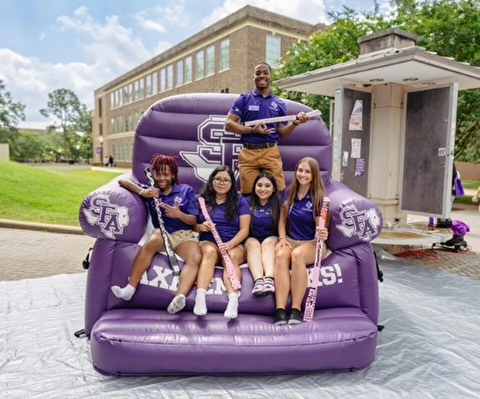 Students on a purple couch celebrate Orientation Season Students on a purple couch celebrate Orientation Season