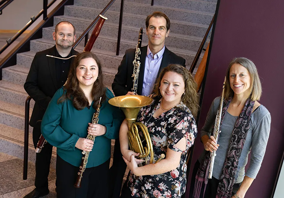 Members of the Stone Fort Wind Quintet holding their instruments