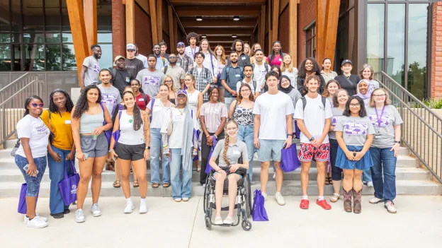 Students posing outside dining hall