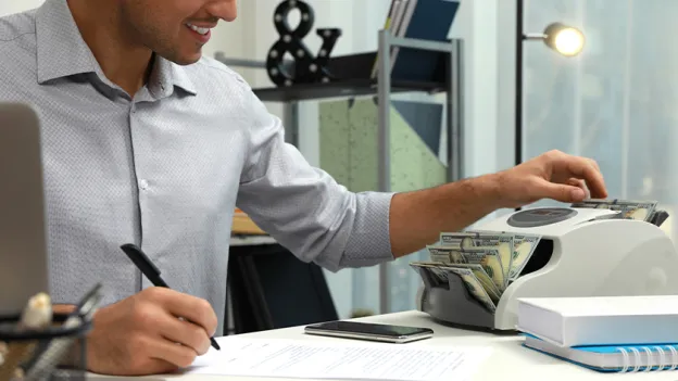 Banker counting money