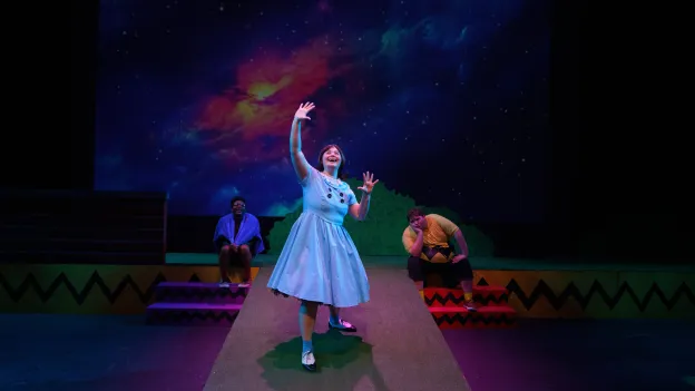 Students performing on stage