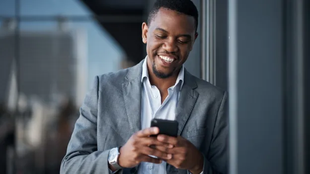 Man, phone and happy in office for professional career