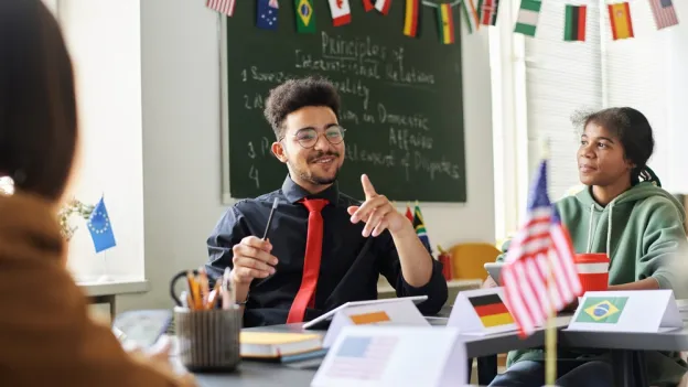 Teacher talking about holiday to students in class