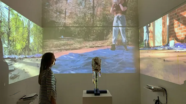 Person viewing an art exhibition