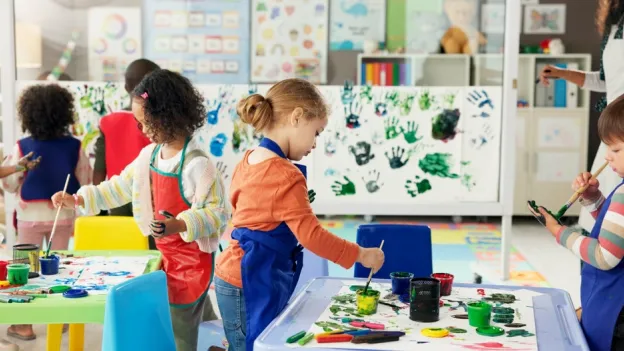 kids painting in classroom