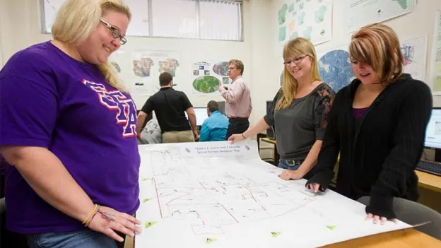 Students looking at a map