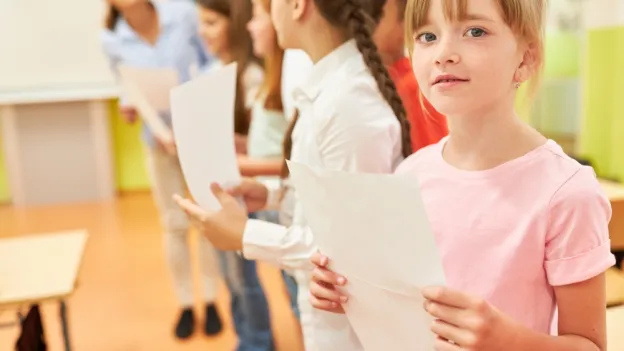 Schoolgirl holding a music sheet