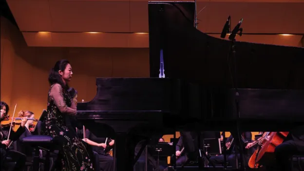 Dr. Minhae Lee performs with the SFA Orchestra