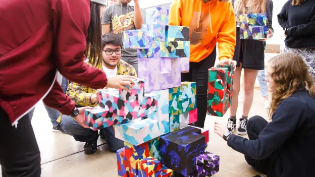Students creating large tetris sculpture