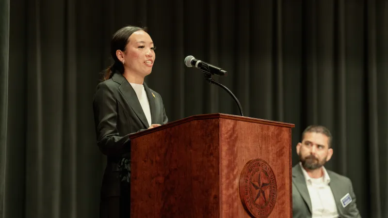 Student speaking at podium