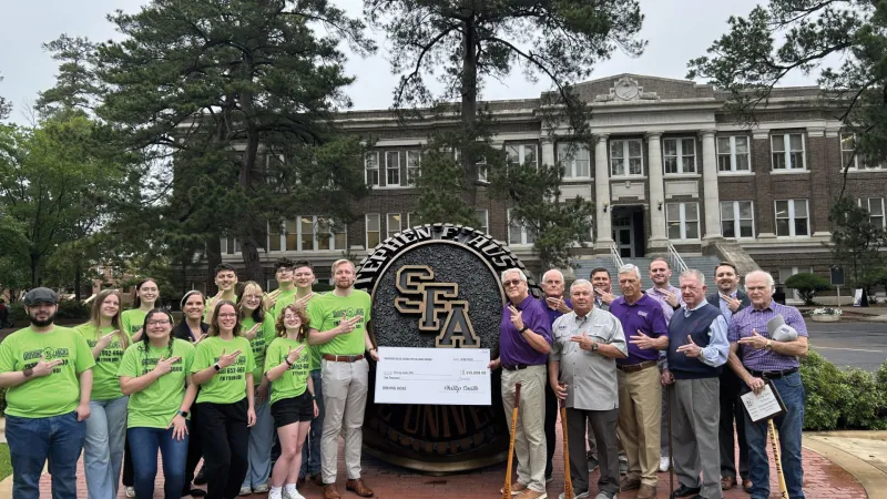 Delta Sigma Phi fraternity presenting a donation of $10,000 to Driving Jacks